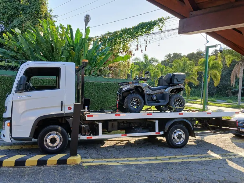 ATV loaded on a Drop Guincho flatbed tow truck